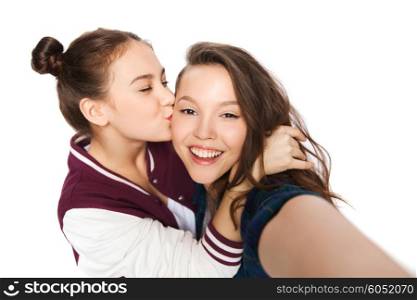 people, friends, teens and friendship concept - happy smiling pretty teenage girls taking selfie and kissing