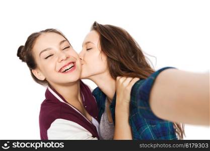 people, friends, teens and friendship concept - happy smiling pretty teenage girls taking selfie and kissing