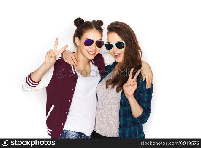people, friendship, fashion, summer and teens concept - happy smiling pretty teenage girls in sunglasses showing peace hand sign