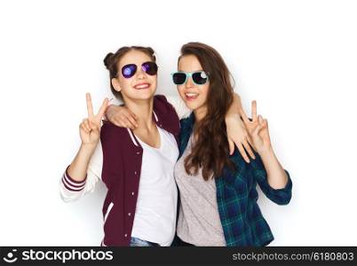 people, friendship, fashion, summer and teens concept - happy smiling pretty teenage girls in sunglasses showing peace hand sign
