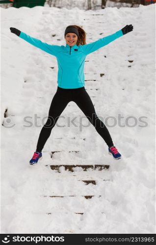 People fun spare time concept. Girl enjoying winter time. Young woman wearing sporty and warm outfit.. Girl enjoying winter time.
