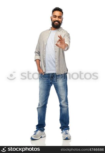 people, gesture and ethnicity concept - happy smiling indian man showing ok hand sign over white