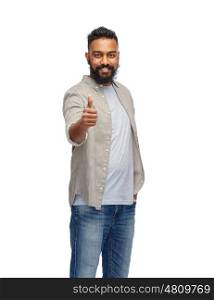 people, gesture and ethnicity concept - happy smiling indian man showing thumbs up over white