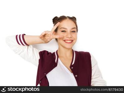 people, gesture and teens concept - happy smiling pretty teenage girl showing peace sign