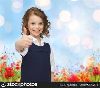 people, gesture, children, summer vacation and happiness concept happy little school girl showing thumbs up over poppy field and blue lights background