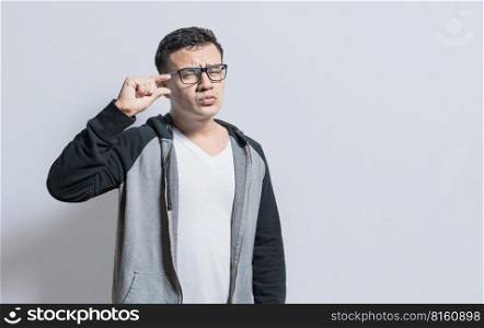 People gesturing with his hand showing something small size with his fingers. man measuring something with fingers, Person showing a small amount with his fingers