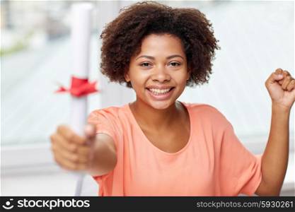 people, graduation and education concept - happy african american woman with diploma at home