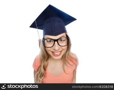people, graduation and education concept - smiling young student woman in mortarboard and eyeglasses