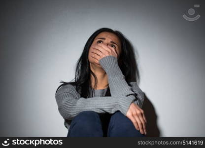 people, grief and domestic violence concept - unhappy crying woman. sad crying woman suffering from domestic violence