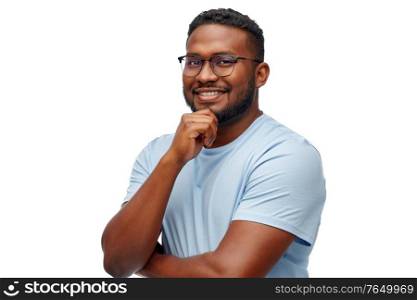 people, grooming and beauty concept - portrait of happy smiling young african american man in glasses over white background. smiling african american man in glasses