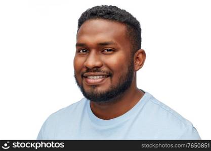 people, grooming and beauty concept - portrait of happy smiling young african american man over white background. portrait of smiling young african american man
