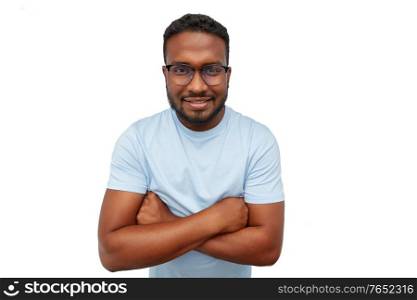 people, grooming and beauty concept - portrait of happy smiling young african american man in glasses with crossed arms over white background. smiling african american man in glasses