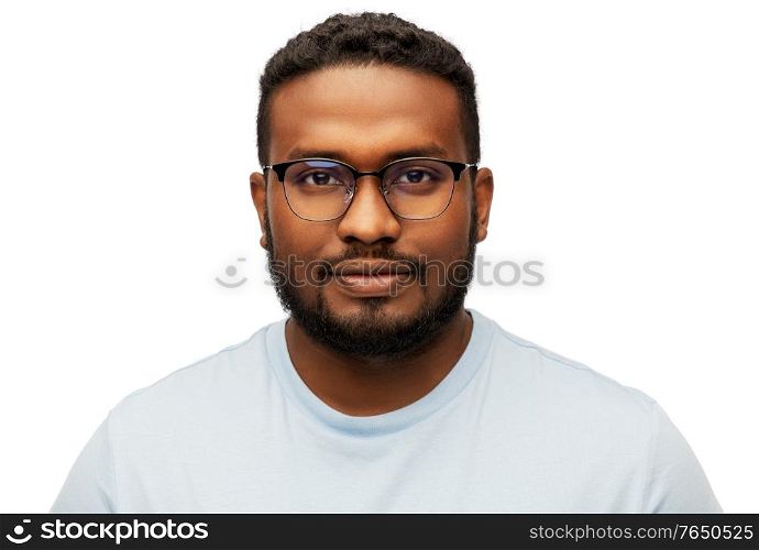 people, grooming and beauty concept - portrait of young african american man in glasses over white background. portrait of african american man in glasses