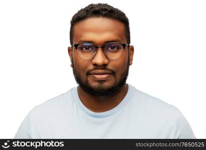 people, grooming and beauty concept - portrait of young african american man in glasses over white background. portrait of african american man in glasses