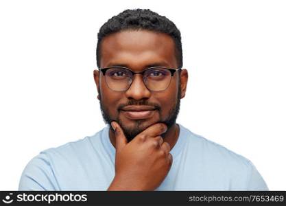 people, grooming and beauty concept - portrait of young african american man in glasses over white background. portrait of young african american in glasses