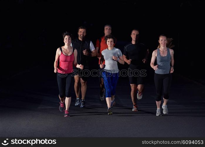 people group jogging at night, runners team on early morning training