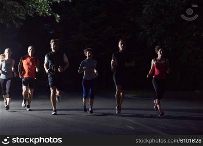 people group jogging at night, runners team on early morning training