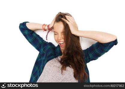 people, hair care, style and teens concept - happy pretty teenage girl holding to head