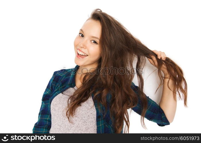 people, hair care, style and teens concept - happy smiling pretty teenage girl touching her head