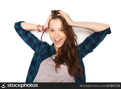 people, hair care, style and teens concept - happy smiling pretty teenage girl touching her head