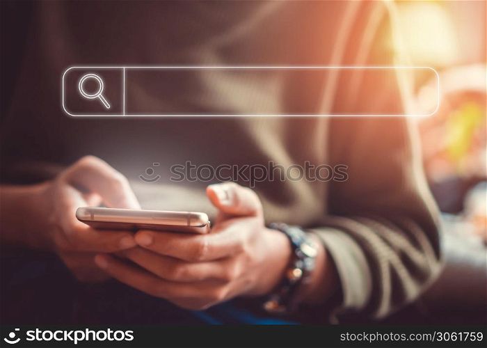 People hand using mobile phone or smartphone searching for information in internet online society web with search box icon and copyspace.