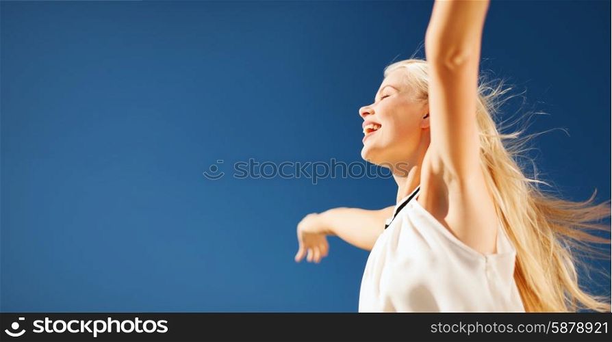 people, happiness, freedom and summer concept - beautiful happy woman enjoying sun outdoors