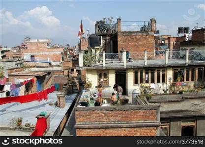 People have bath on the roof of building in Patan, Nepal