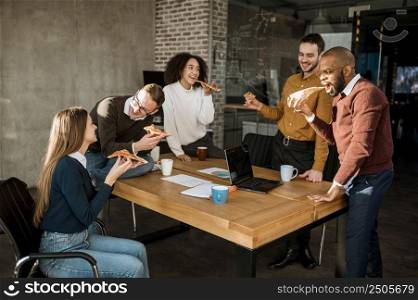 people having pizza during office meeting break