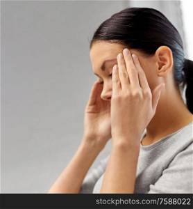 people, health, stress and problem concept - close up of unhappy woman having headache. close up of unhappy woman having headache