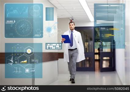 people, healthcare and medicine concept - doctor with clipboard walking along hospital corridor. doctor with clipboard walking along hospital