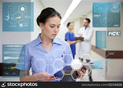 people, healthcare and medicine concept - female doctor or nurse with clipboard at hospital. female doctor or nurse with clipboard at hospital