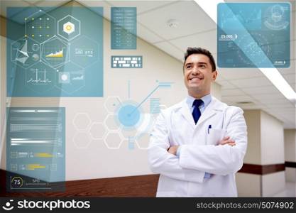 people, healthcare and medicine concept - smiling doctor at hospital corridor. smiling doctor at hospital corridor