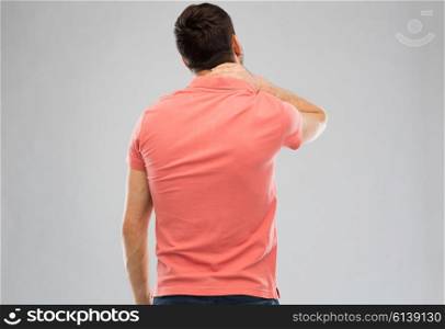 people, healthcare and problem concept - man suffering from neck pain