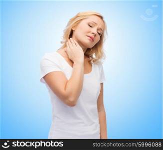 people, healthcare and problem concept - unhappy middle aged woman suffering from neck pain over blue background