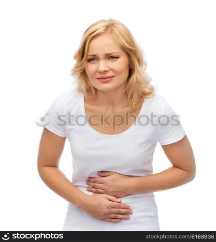 people, healthcare and problem concept - unhappy woman suffering from stomach ache
