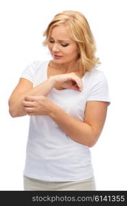 people, healthcare, dermatology, allergy and health problem concept - unhappy woman suffering from hand inch