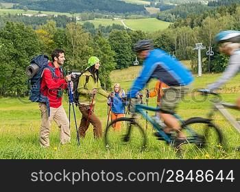 People hiking and riding bikes on summer vacation nature landscape