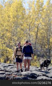 People Hiking with Dog