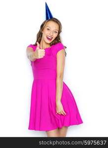 people, holidays and celebration concept - happy young woman or teen girl in pink dress and party cap