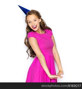people, holidays and celebration concept - happy young woman or teen girl in pink dress and party cap