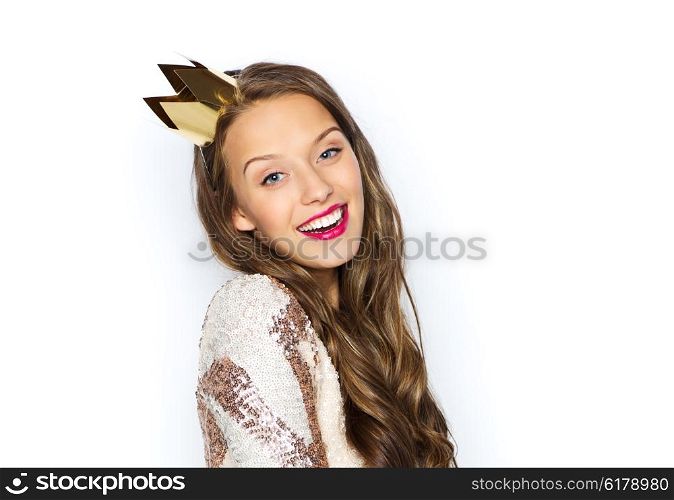people, holidays and celebration concept - happy young woman or teen girl in party dress and princess crown