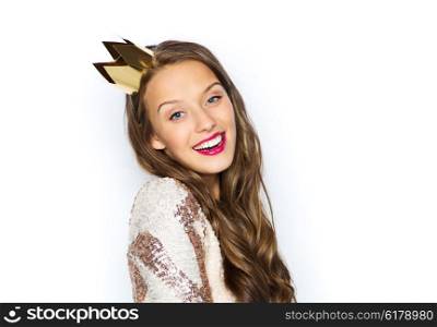 people, holidays and celebration concept - happy young woman or teen girl in party dress and princess crown