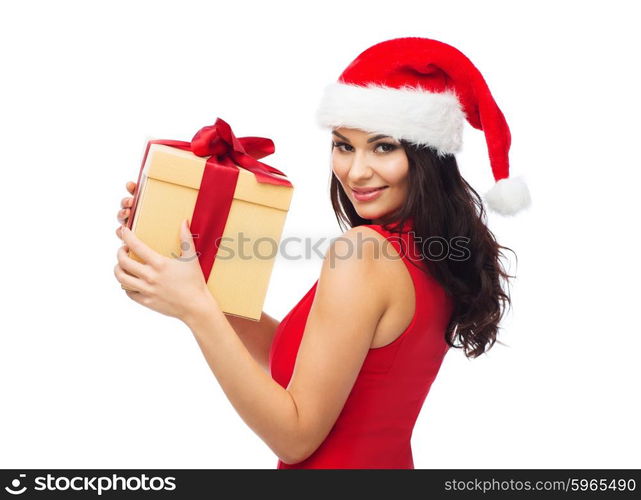 people, holidays, christmas and celebration concept - beautiful sexy woman in red dress and santa hat with gift box