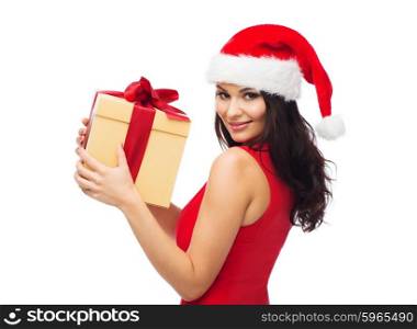 people, holidays, christmas and celebration concept - beautiful sexy woman in red dress and santa hat with gift box