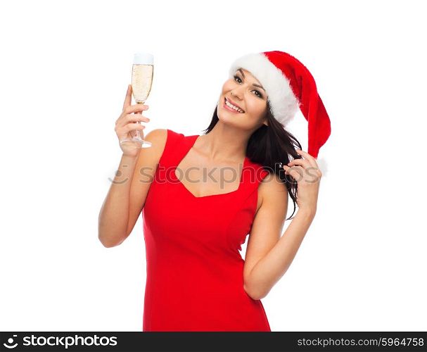 people, holidays, christmas and celebration concept - beautiful sexy woman in santa hat and red dress with champagne glass