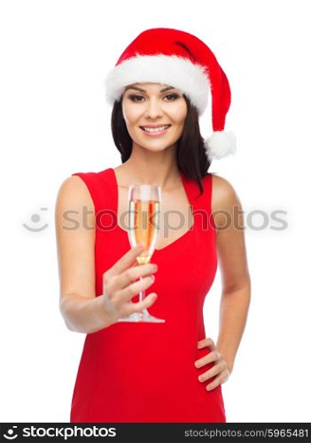 people, holidays, christmas and celebration concept - beautiful sexy woman in santa hat and red dress with champagne glass