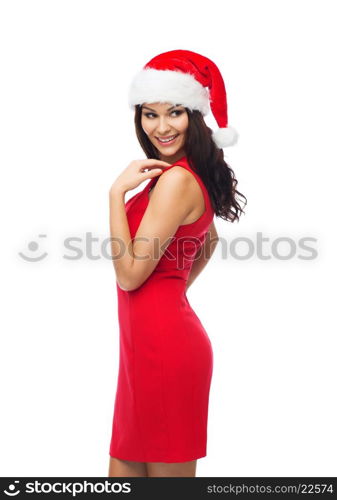 people, holidays, christmas and celebration concept - beautiful sexy woman in santa hat and red dress