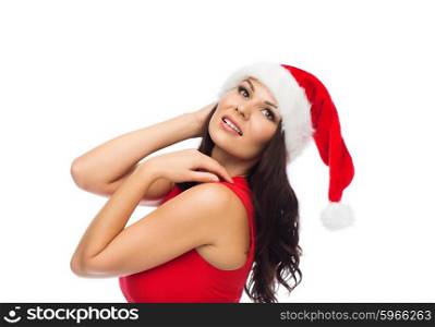 people, holidays, christmas and celebration concept - beautiful sexy woman in santa hat and red dress