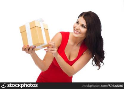 people, holidays, christmas, birthday and celebration concept - beautiful sexy woman in red dress with gift box