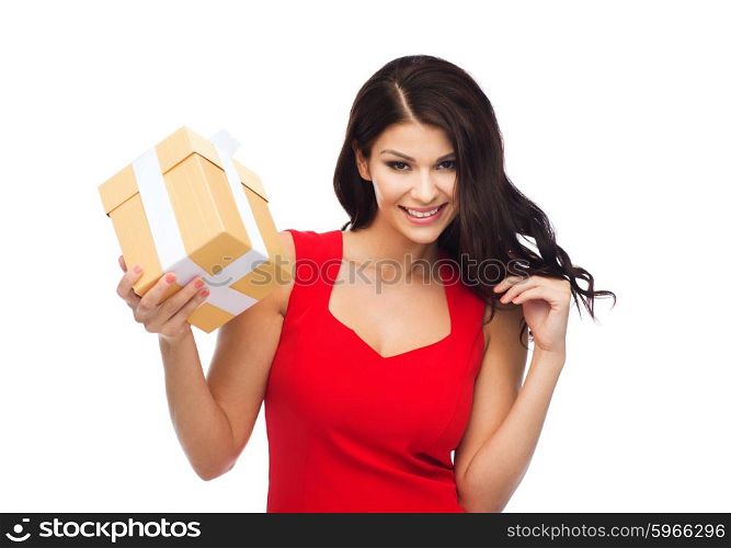 people, holidays, christmas, birthday and celebration concept - beautiful sexy woman in red dress with gift box